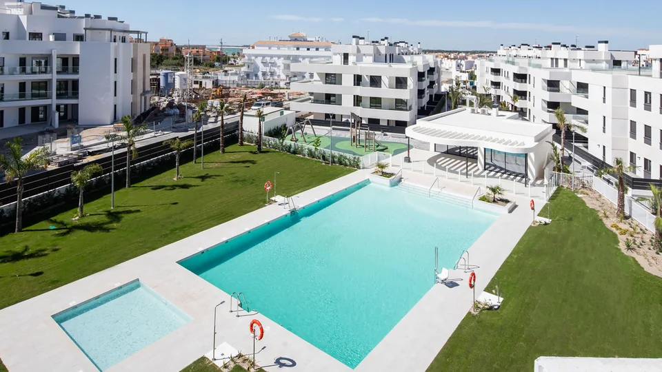 Aerial view of a new build development with its swimming pool and communal areas